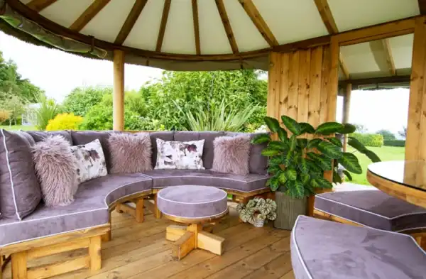 Breeze House Oval Savannah with purple bench cushions
