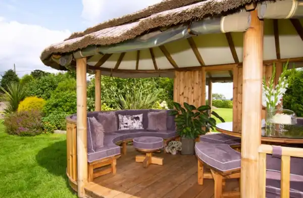 Breeze House Oval Savannah with purple bench cushions