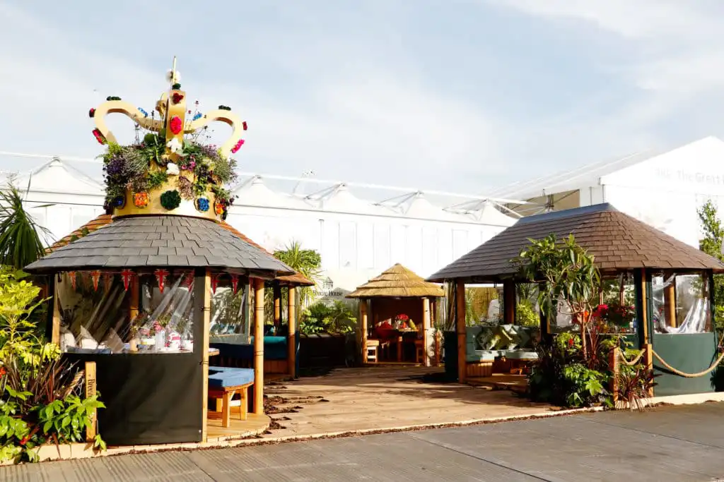 Giant planted crown on the roof of a Breeze House garden building at Chelsea Flower Show 2022