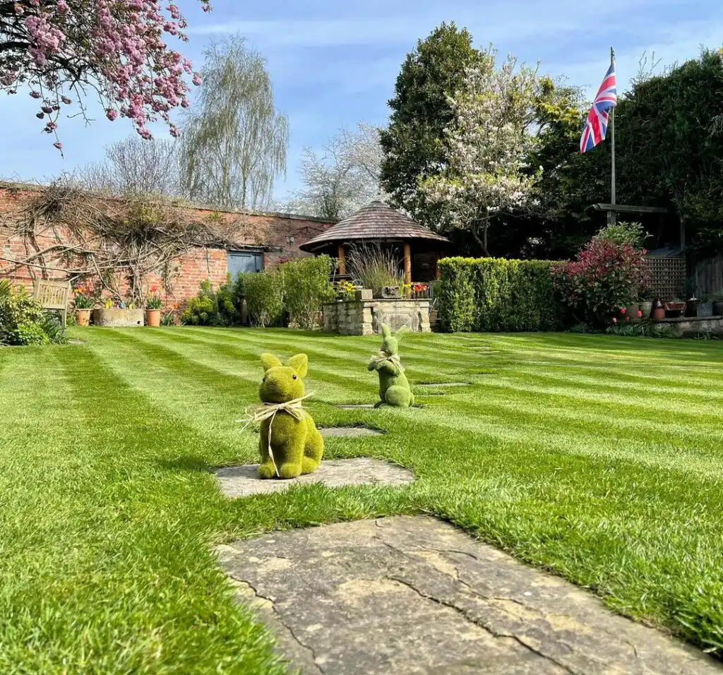 Grass Easter bunnies in front of Breeze House