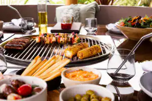 close up view of food cooking on grill inside breeze house grill