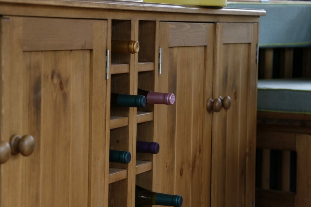 close view of breeze house wine cabinet containing wine bottles