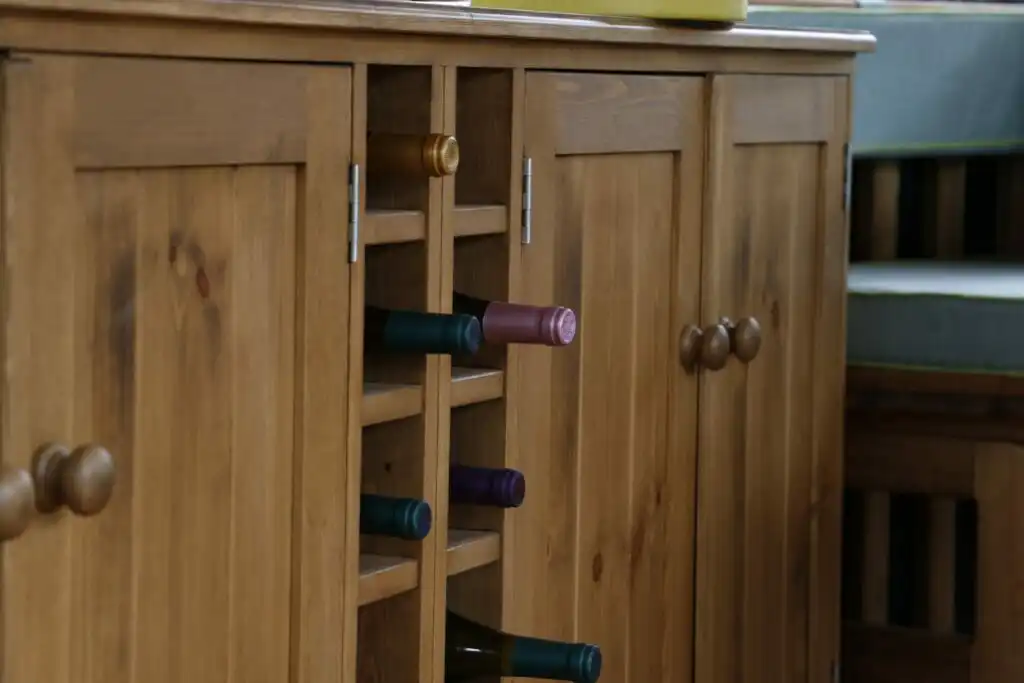 close view of breeze house wine cabinet containing wine bottles