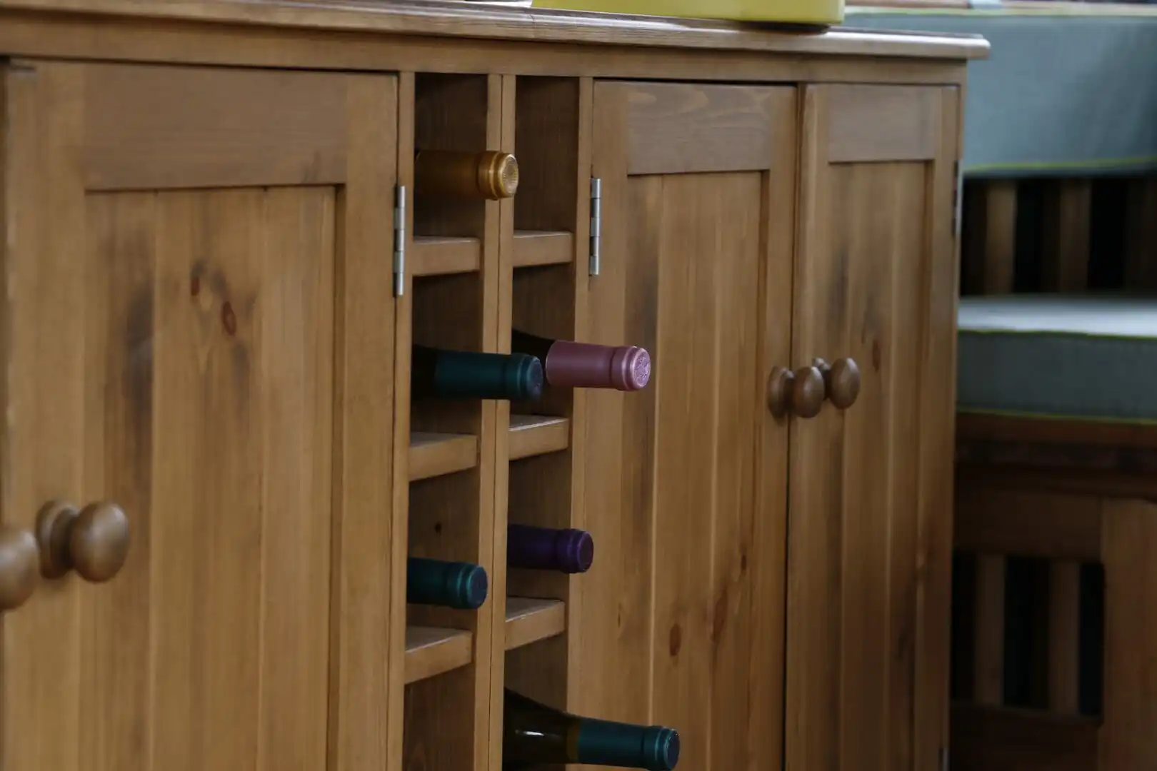 close view of breeze house wine cabinet containing wine bottles