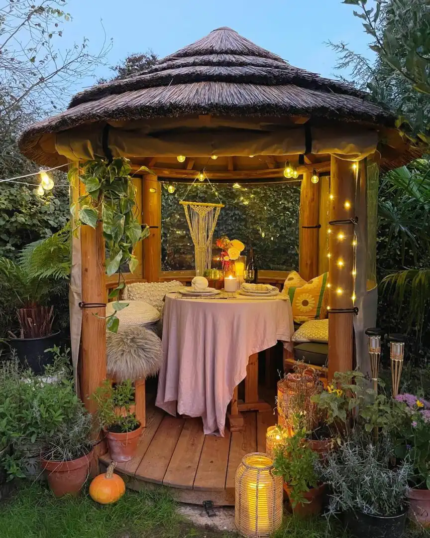 Dani Sandels Mara Breeze House at night lit with festoon lights.