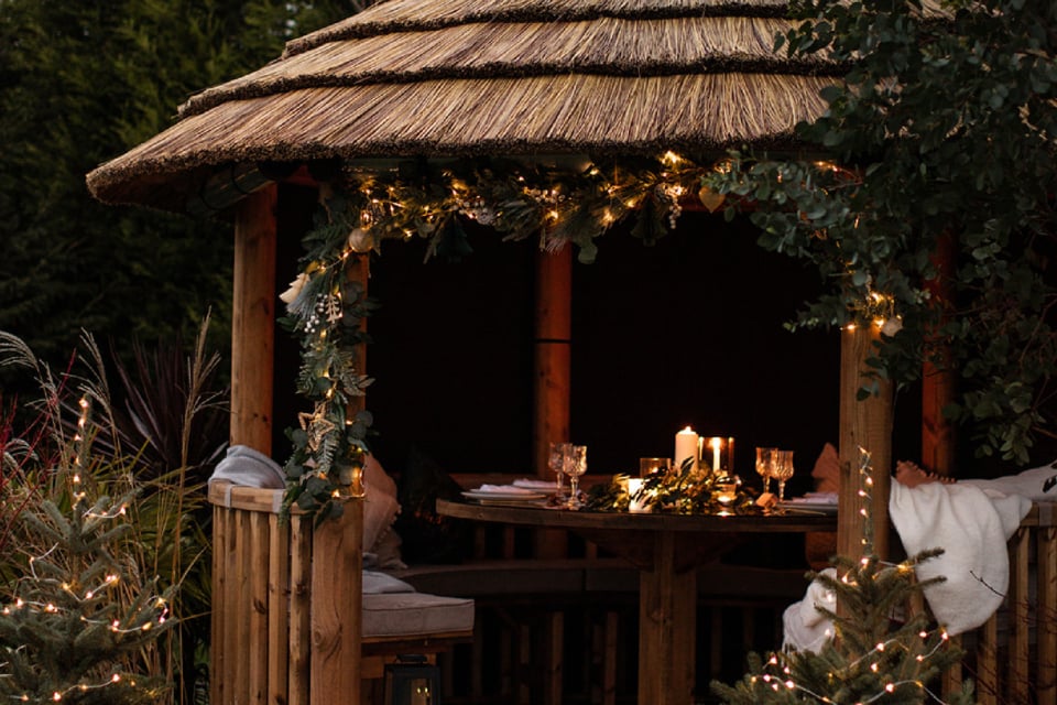 Breeze House decorated with christmas wreaths and fairy lights