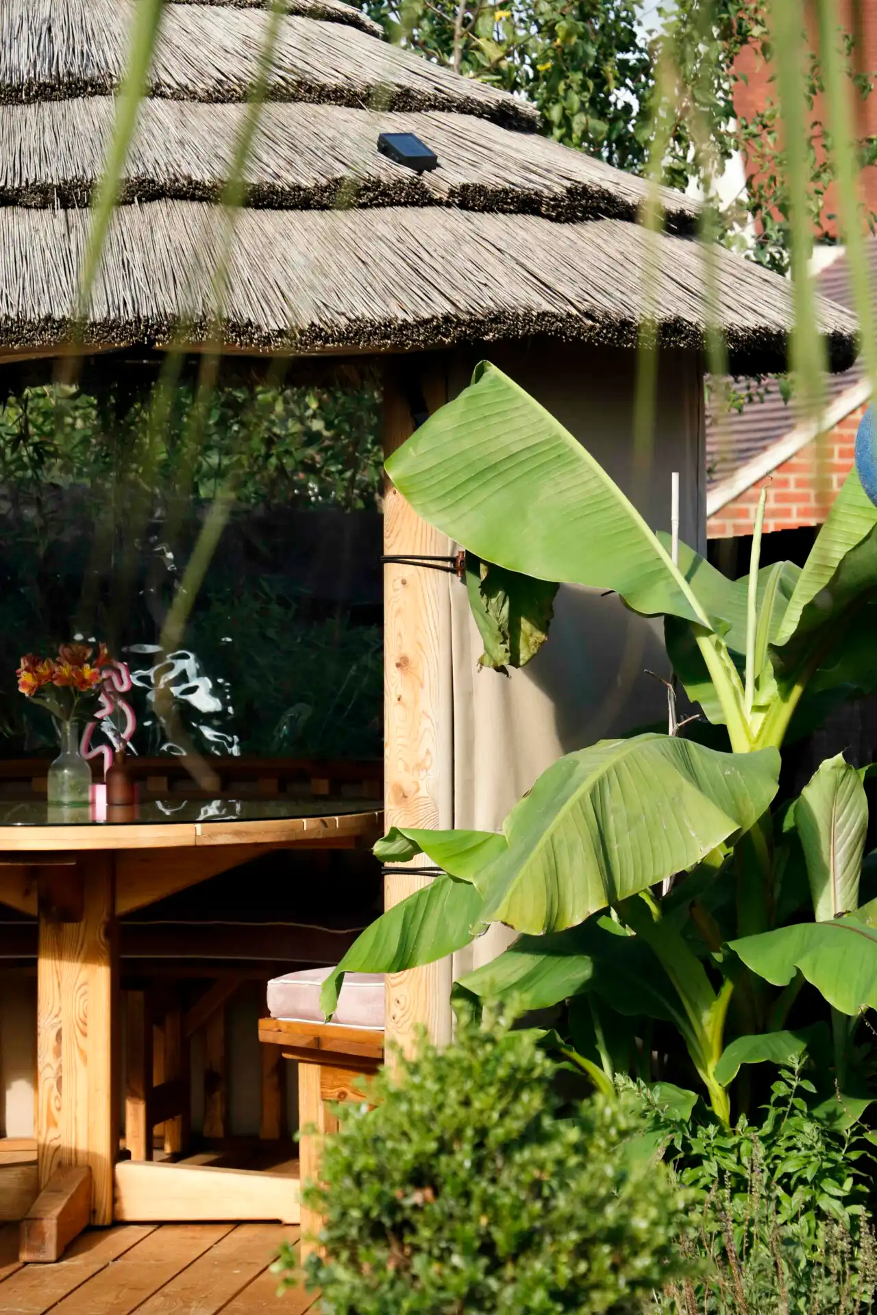 Thatched breeze house inside garden