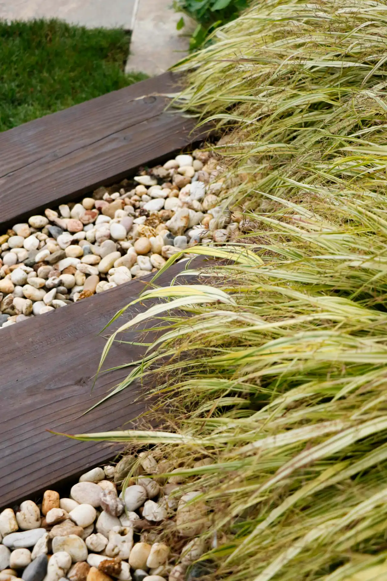 Outdoor garden wooden steps with gravel
