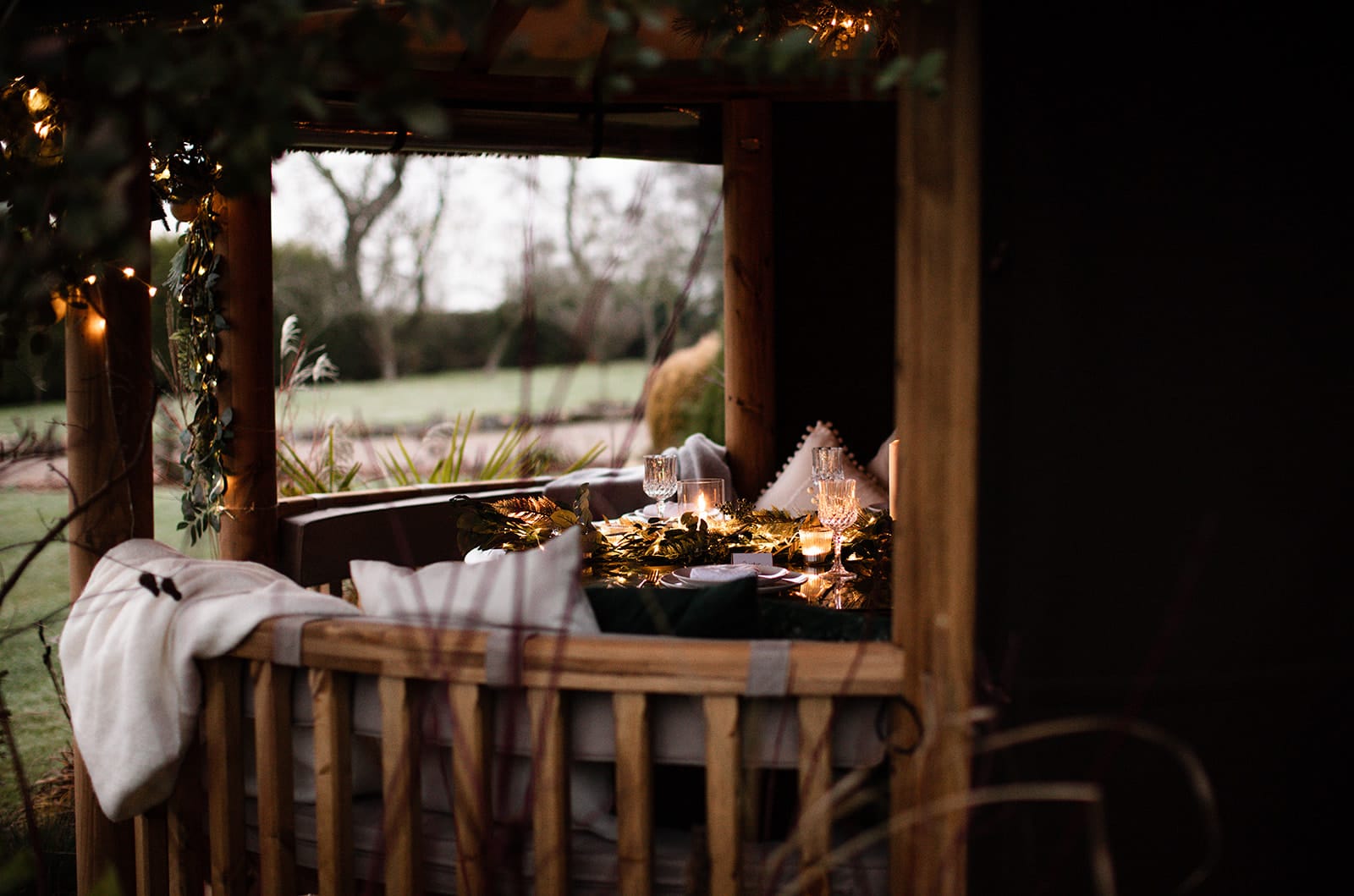 table inside breeze house gazebo decorated with christmas decorations
