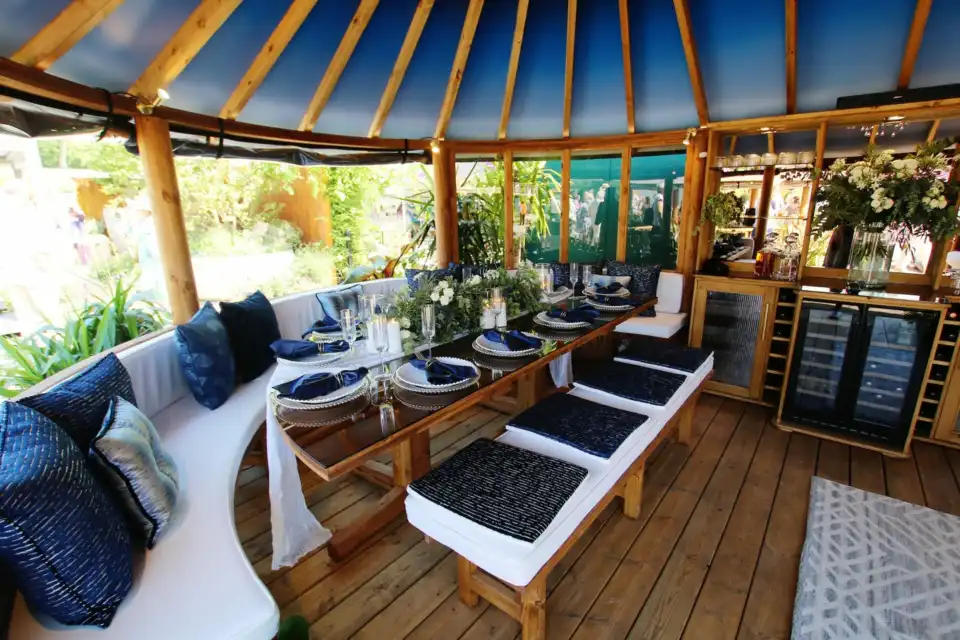 bench seating inside breeze house celebration styled for RHS chelsea 2024