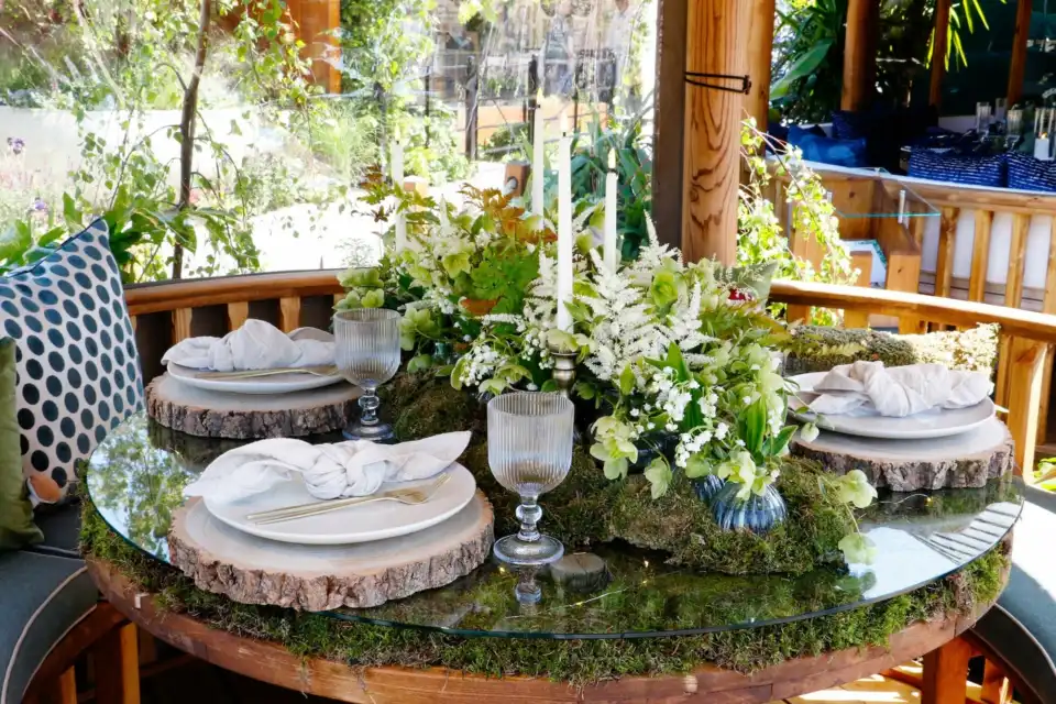interior of breeze house enchanted woodland styled for RHS chelsea 2024 featuring living table