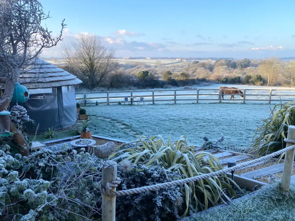 Breeze House in vast frosty garden overlooking countryside