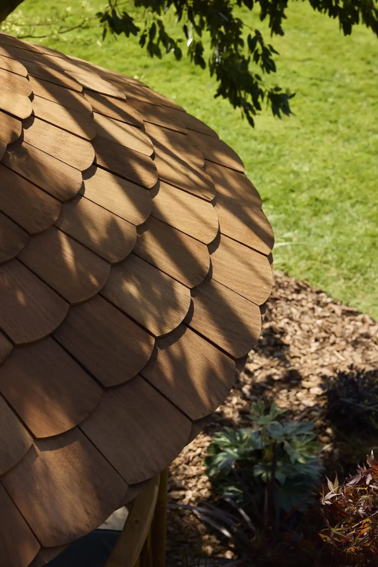 shadows of leaves and tress visible on roof of RHS breeze house
